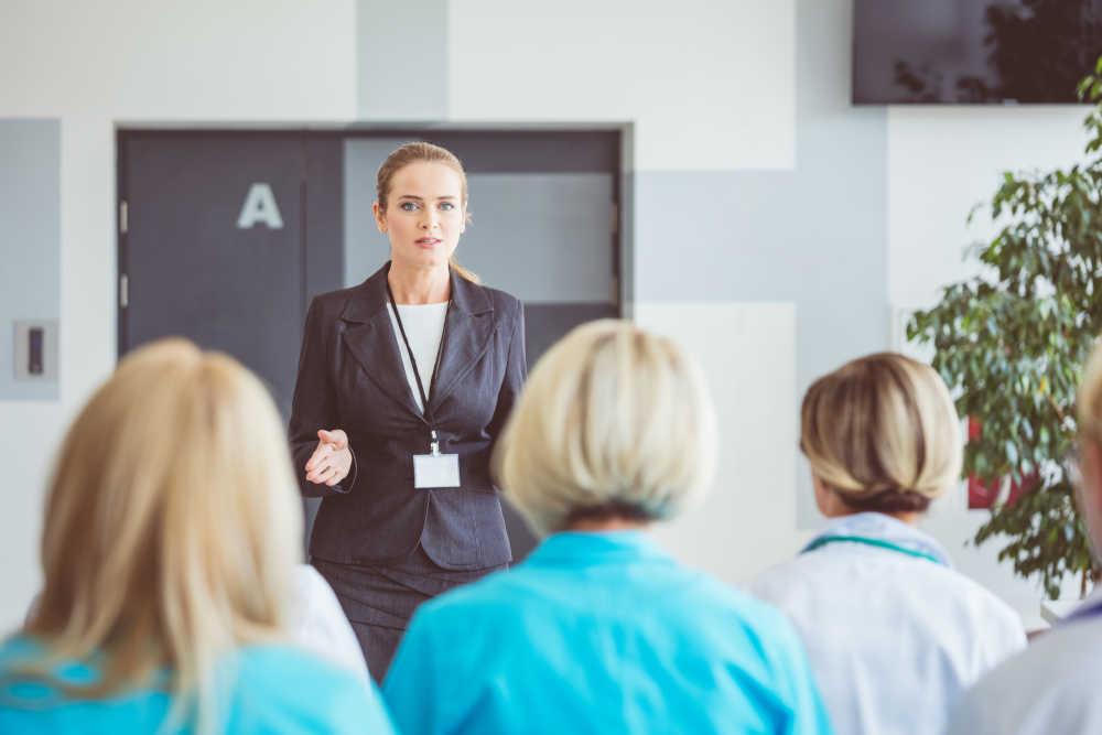 Woman giving a speech on seminar for medical staff